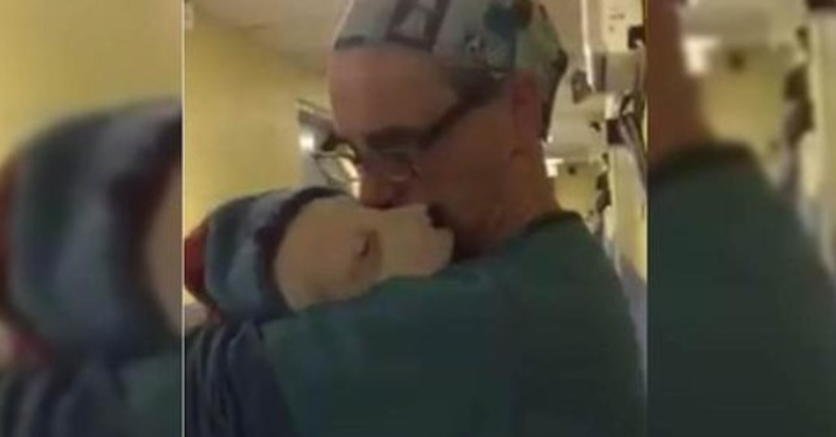 Vet Cradles Scared and Crying Rescue Puppy Just Like a Baby After Surgery